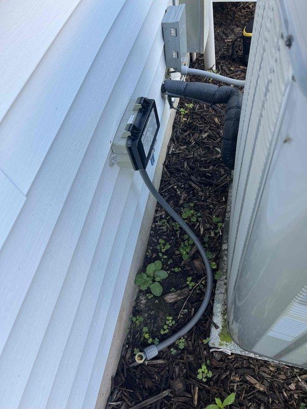 Completed annual cooling maintenance on EnergiAir system. Performed comprehensive tune-up including inspection of outdoor condensing unit, refrigerant lines, and Honeywell ProSeries programmable thermostat. Verified thermostat operation in cooling mode with fan set to auto, confirmed WiFi connectivity, and ensured proper temperature control at 71°F setpoint. Inspected outdoor unit installation, checked refrigerant line insulation integrity, and verified proper drainage in mulched service area. All components operating within normal parameters. System ready for cooling season.