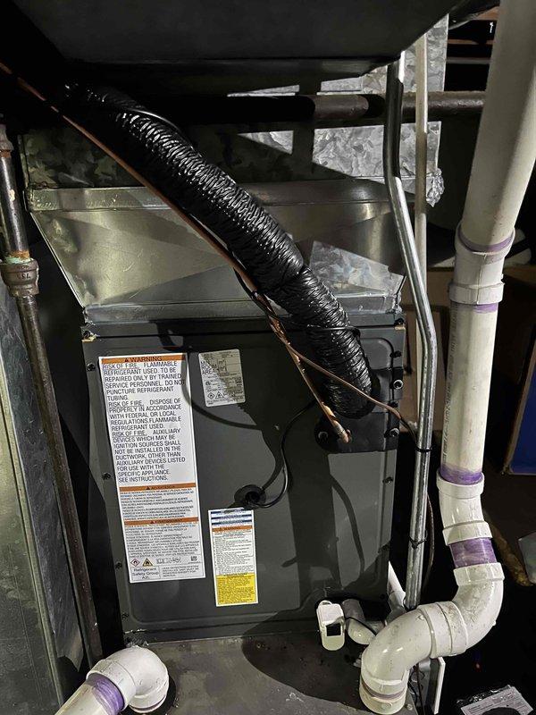 Completed full HVAC system replacement including outdoor condenser unit and indoor air handler. Installed new condenser on existing concrete pad with proper electrical disconnect and conduit connections to exterior wall. Mounted air handler in attic space with secure positioning and proper clearances. Connected refrigerant lines between indoor and outdoor units using copper line sets. Installed PVC condensate drain piping with proper pitch and connections. Verified all electrical connections, tested system startup, and confirmed proper operation of both heating and cooling functions. All components labeled appropriately and installation meets manufacturer specifications and local code requirements.