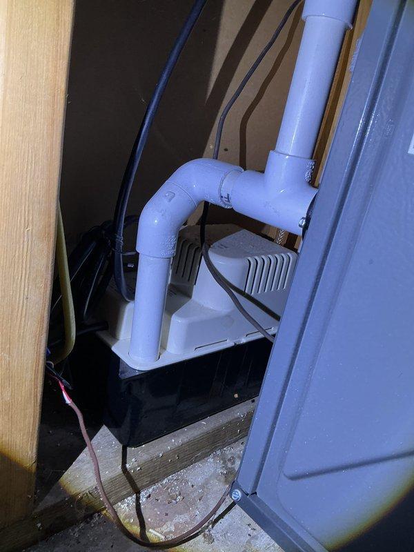 Completed annual cooling system maintenance and inspection. Serviced condensate pump and drainage system in utility closet, verified proper operation and drainage flow. Inspected outdoor condenser unit and noted heavy dirt and debris accumulation on coil fins requiring attention. Documented system conditions with photographs for maintenance records.