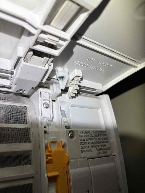 Responded to service call for 2011 Fujitsu ductless mini-split system with motorized vane slider malfunction. Upon arrival, confirmed unit was providing heating and cooling normally with no operational issues, error codes, or unusual noises. Removed front cover and inspected internal swing louver assembly and actuator motor mechanism. Found swing motor assembly binding due to mechanical obstruction in linkage arm. Cleared obstruction, lubricated pivot points on swing mechanism, and tested full range of motion. Cycled louver through all positions to verify proper operation. Reinstalled housing cover and confirmed vane movement responds correctly to remote control commands. Unit operating as designed with restored airflow direction control.