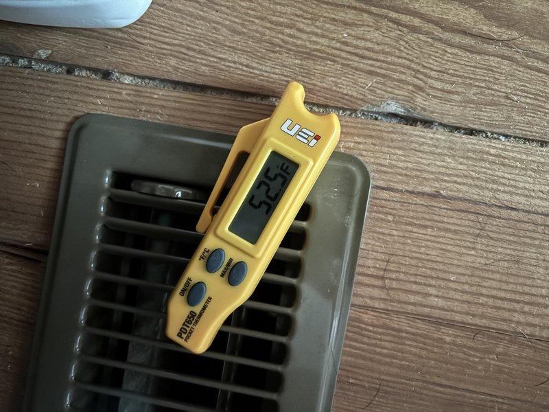 Responded to no cooling complaint on 1-year-old Carrier system with thermostat set to 70°F but home temperature at 78°F. Upon arrival, confirmed warm air discharge from supply registers. Performed temperature measurements at multiple supply vents throughout the home, recording discharge air temperatures of 52.3°F and 55.8°F, which indicated the system was producing cooled air but insufficient for the load or airflow issues were present. Conducted system diagnostics to identify root cause of inadequate cooling performance. Documented findings with thermal measurements at floor registers to verify air temperatures being delivered to conditioned space.