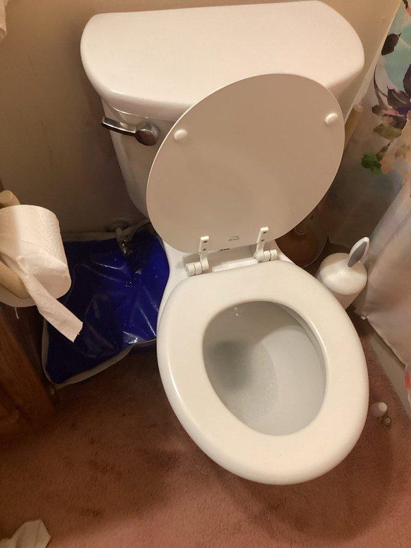 Responded to call for rocking toilet at base. Upon inspection, found toilet flange bolts corroded and loose, causing instability. Removed toilet to access flange hardware, replaced deteriorated closet bolts and washers, reset toilet with new wax ring to ensure proper seal, and torqued bolts evenly to secure fixture. Verified toilet stability and tested flush operation to confirm no leaks at base or water supply connection.