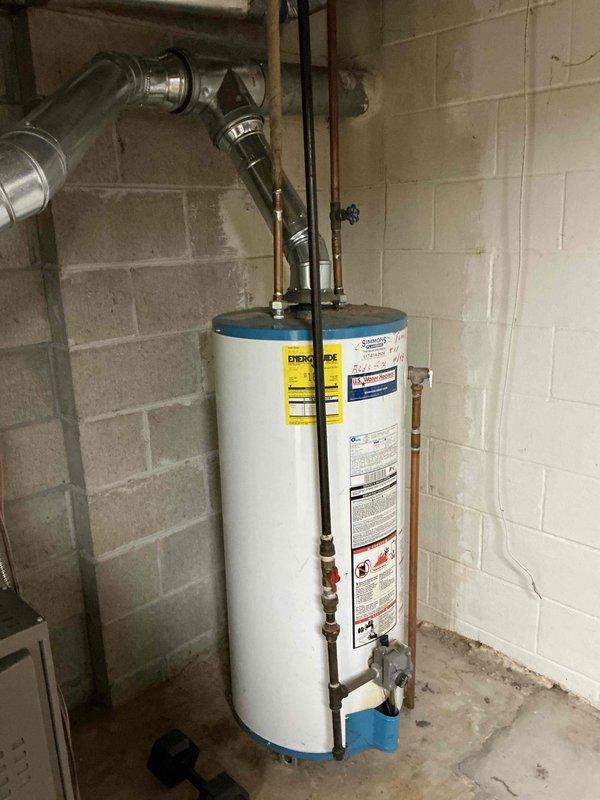 Conducted on-site evaluation of existing 16-year-old residential water heater for replacement estimate. Assessed current installation including copper supply lines, shut-off valves, temperature and pressure relief valve with discharge piping, and venting configuration. Documented equipment specifications, plumbing connections, and utility room conditions to provide accurate replacement proposal qualifying for utility rebate program.