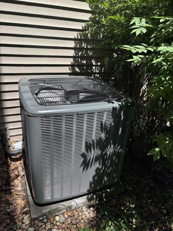 Responded to service call regarding excess condensation observed on AC coils by insurance inspector. Performed complete system inspection on four-year-old EnergiAir unit that was reportedly still cooling properly. Inspected outdoor condenser unit, verified proper operation of all components, checked refrigerant levels, and examined coil condition. Found system operating within normal parameters with no significant issues detected. Documented equipment condition with photos showing condenser unit in good physical condition with clean exterior surfaces and proper installation on concrete pad. Confirmed unit functionality and advised on normal condensation expectations during high-humidity conditions.