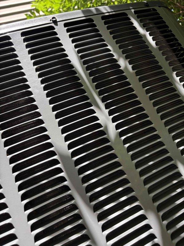 Responded to service call regarding excess condensation observed on AC coils by insurance inspector. Performed complete system inspection on four-year-old EnergiAir unit that was reportedly still cooling properly. Inspected outdoor condenser unit, verified proper operation of all components, checked refrigerant levels, and examined coil condition. Found system operating within normal parameters with no significant issues detected. Documented equipment condition with photos showing condenser unit in good physical condition with clean exterior surfaces and proper installation on concrete pad. Confirmed unit functionality and advised on normal condensation expectations during high-humidity conditions.