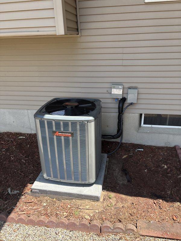 Completed full residential air conditioning system replacement. Installed new outdoor condensing unit on existing concrete pad against house exterior with proper refrigerant line connections, electrical conduit routing, and disconnect box mounting. System was charged with refrigerant, tested for proper operation, and all connections were verified for secure installation and code compliance.