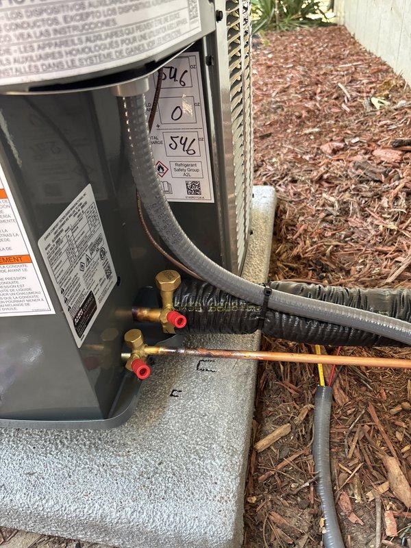 Completed full residential air conditioning system replacement. Installed new outdoor condensing unit on existing concrete pad against house exterior with proper refrigerant line connections, electrical conduit routing, and disconnect box mounting. System was charged with refrigerant, tested for proper operation, and all connections were verified for secure installation and code compliance.