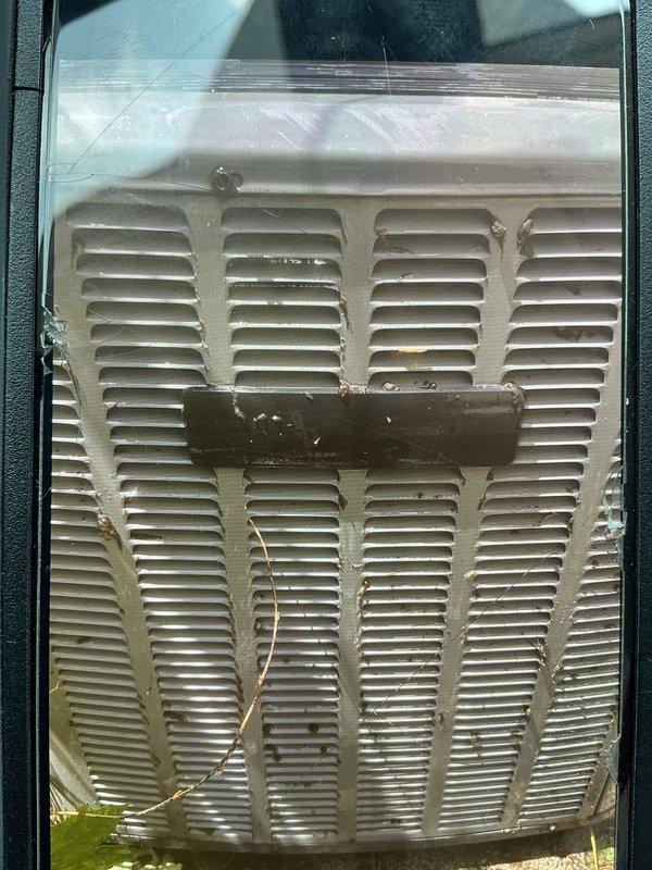Responded to cooling complaint on 13-year-old EnergiAir system with reduced cooling capacity affecting entire home. Upon inspection, examined evaporator coil assembly and air distribution components, documenting condition of heat exchanger fins and ventilation grille. System evaluated for airflow restrictions and component performance to determine cause of diminished cooling output.