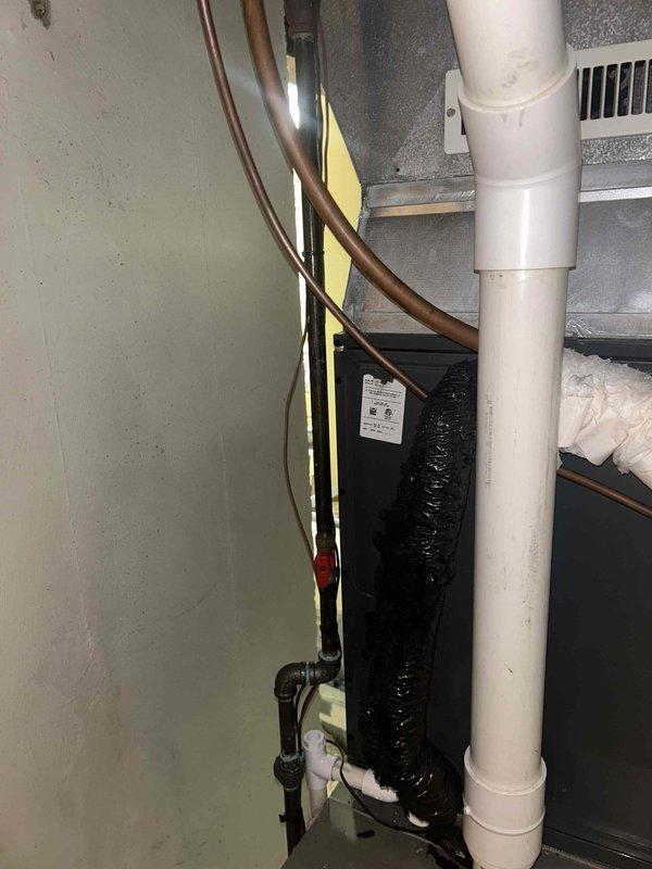 Responded to no cooling call and diagnosed HVAC system failure caused by animal damage. Found that a cat had chewed through control wiring running to the furnace, interrupting communication between the air handler and heating system. Repaired the damaged low-voltage wiring, restored proper electrical connections, and verified system operation. Both air conditioning and furnace returned to normal function after wire repair was completed.