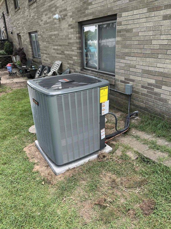 Complete HVAC system replacement performed, including installation of new air handler unit and furnace assembly in interior utility space, along with outdoor condensing unit. Interior components installed in vertical stack configuration with proper ductwork connections, electrical integration, and PVC condensate drainage routing. Outdoor condensing unit positioned on concrete pad with electrical disconnect box mounted to exterior wall and conduit properly run. All units branded ENERGI AIR SYSTEMS with appropriate manufacturer labels, specification plates, and EnergyGuide documentation affixed. System tested and verified operational upon completion.
