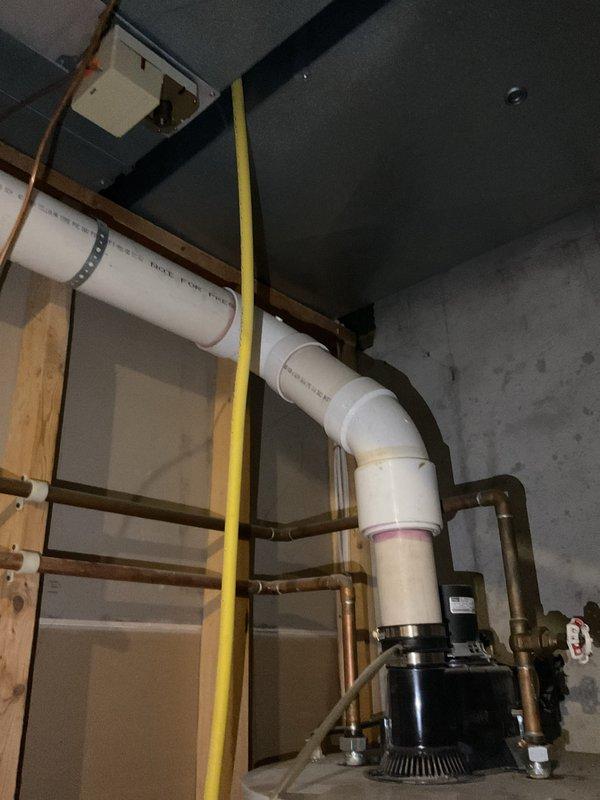 Responded to service call for leaking water heater. Upon arrival, inspected 24-year-old Bradford White water heater installation in basement utility area. Confirmed active leak from aging tank unit. Documented existing system configuration including copper supply and return piping, circulator pump assembly mounted at top of tank, PVC venting system, and all associated valves and connections. Photographed current installation showing water heater positioned against concrete wall with complete plumbing infrastructure. Provided comprehensive estimate for replacement of failed water heater unit with new equipment to restore hot water service and eliminate leak condition.