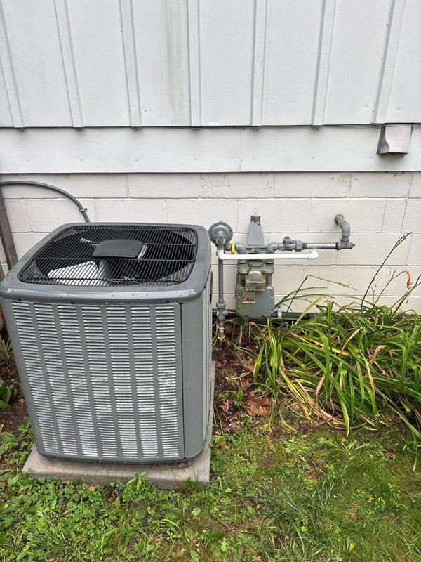 Responded to inspection correction notice for outdoor A/C unit installation. Relocated contactor to achieve required 3-foot clearance from gas meter regulator per code requirements. Installed disconnect switch within sight of condensing unit to meet NEC compliance standards. Verified all electrical connections, tested unit operation, and documented final installation with measurements confirming proper spacing between equipment and gas service components.