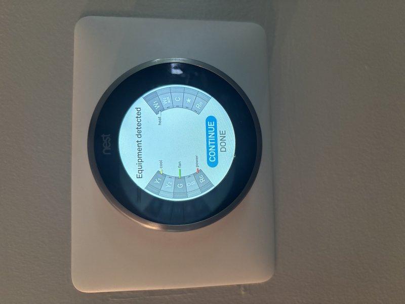 Responded to no cooling call on 8-month-old EnergiAir system displaying E73 error code on Nest thermostat. Upon arrival, found thermostat in equipment detection mode with wiring exposed at base, indicating loss of communication between thermostat and HVAC system. Verified thermostat had become unseated from wall plate, causing intermittent connection with R and C wires. Reseated thermostat onto base plate, confirmed proper wire engagement in terminals, and ran equipment detection sequence. System successfully reconnected, E73 error cleared, and verified proper communication between thermostat and air handler. Cycled system through cooling mode to confirm proper operation and airflow throughout home.