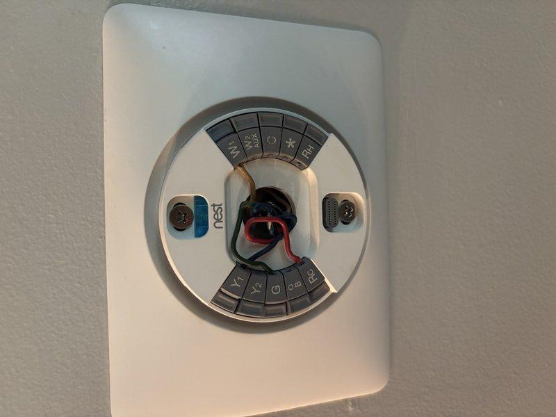 Responded to no cooling call on 8-month-old EnergiAir system displaying E73 error code on Nest thermostat. Upon arrival, found thermostat in equipment detection mode with wiring exposed at base, indicating loss of communication between thermostat and HVAC system. Verified thermostat had become unseated from wall plate, causing intermittent connection with R and C wires. Reseated thermostat onto base plate, confirmed proper wire engagement in terminals, and ran equipment detection sequence. System successfully reconnected, E73 error cleared, and verified proper communication between thermostat and air handler. Cycled system through cooling mode to confirm proper operation and airflow throughout home.