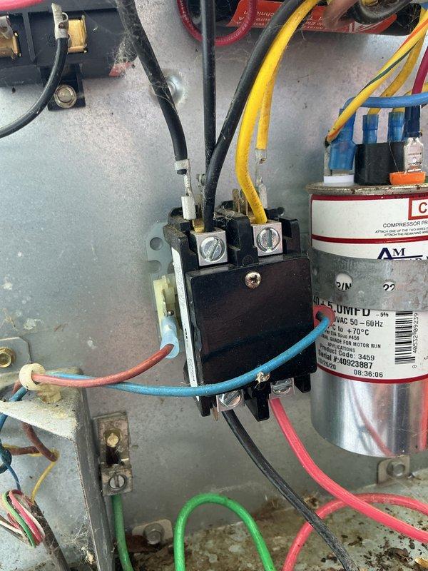 # NC-No Cool Service Completed

Responded to service call for 11-year-old air conditioning system not cooling residence. Upon arrival, performed diagnostic inspection of outdoor condensing unit. Visual inspection revealed failed contactor with severely corroded terminals, preventing compressor and condenser fan operation. Corroded spade terminals were discovered disconnected from contactor, exhibiting significant oxidation and deterioration due to age and environmental exposure.

Removed defective contactor and cleaned all electrical connection points. Replaced failed contactor with new unit and installed fresh spade terminals to ensure proper electrical connectivity. Verified all wire connections were secure and properly terminated. Tested capacitor for proper microfarad rating and voltage - readings within acceptable range. Restored power to unit and confirmed compressor and condenser fan motor startup. System operating normally with proper cooling cycle achieved. Customer notified v