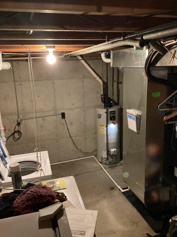 Responded to follow-up service call for 19-year-old Bradford White 40-gallon gas water heater (Model M1TW40S6FCX) that remained inoperative following previous service visits. Upon inspection, evaluated unit's condition and operational status in basement utility area. Given the age of the equipment and continued failure to ignite or operate, documented existing installation and provided assessment for customer decision-making regarding repair versus replacement options.