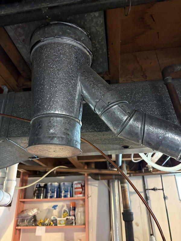Completed installation of 40-gallon natural gas short water heater in basement utility area. Removed existing unit and installed new water heater with proper venting through flue assembly, connected supply and discharge lines using copper piping with brass fittings and valves, and ensured all connections were secure and code-compliant. System tested and verified operational upon completion.