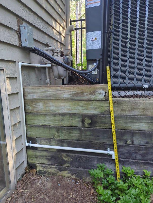Responded to inspector correction notice regarding gas meter regulator placement in relation to air conditioning condenser unit. Verified clearance measurements between gas piping components and HVAC equipment to ensure compliance with NFPA code requirements mandating minimum 3-foot separation distance. Documented existing installation conditions and confirmed proper spacing between gas meter regulator assembly and condenser unit meets safety standards.