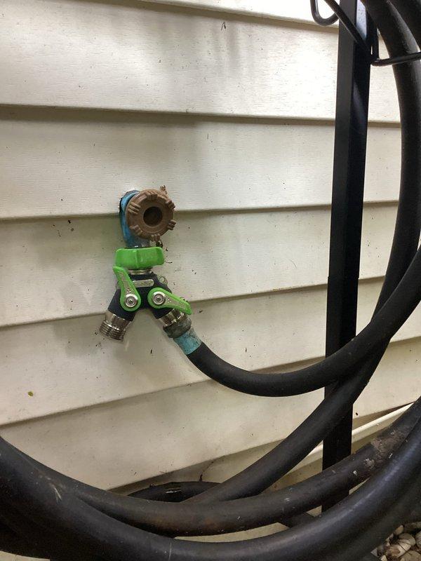 Responded to a four-day ongoing issue with a broken front exterior water faucet on a late 1960s home. Replaced the faulty hose bib mounted on the brick exterior wall with a new brass frost-proof sillcock, ensuring proper seal and connection to the existing galvanized supply line. Installed a dual-outlet hose splitter assembly with brass adapters on the white vinyl siding section to provide additional water access points for outdoor use. Tested both fixtures under full pressure to verify no leaks and confirmed proper operation of all valves and connections.