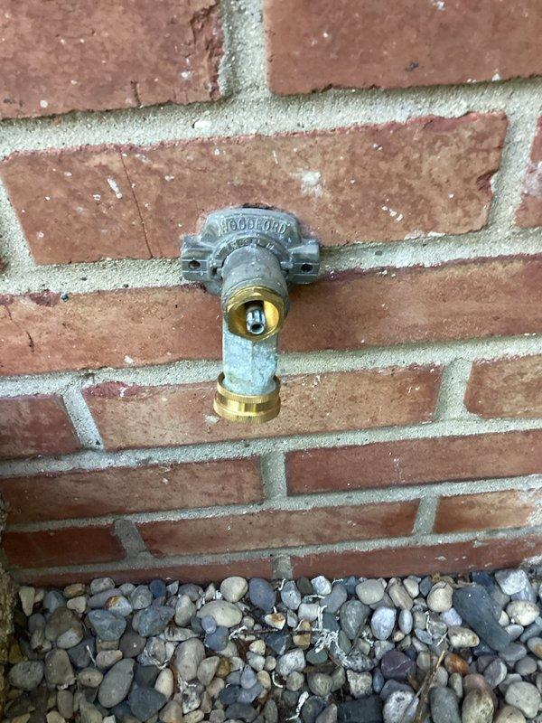 Responded to a four-day ongoing issue with a broken front exterior water faucet on a late 1960s home. Replaced the faulty hose bib mounted on the brick exterior wall with a new brass frost-proof sillcock, ensuring proper seal and connection to the existing galvanized supply line. Installed a dual-outlet hose splitter assembly with brass adapters on the white vinyl siding section to provide additional water access points for outdoor use. Tested both fixtures under full pressure to verify no leaks and confirmed proper operation of all valves and connections.