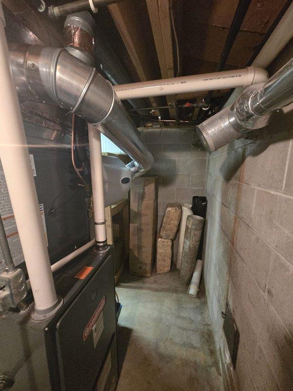 Completed full air conditioning system replacement at residential property. Removed existing outdoor condensing unit and installed new 14.3 SEER rated AC system. Connected refrigerant lines to existing indoor air handler/furnace unit located in basement mechanical room. Performed refrigerant charging procedures using manifold gauge set to verify proper system pressures and refrigerant levels across both high and low side circuits. Verified all electrical connections, tested system operation through complete cooling cycle, and confirmed proper airflow through ductwork. System commissioned and left in full working order with optimal performance parameters achieved.
