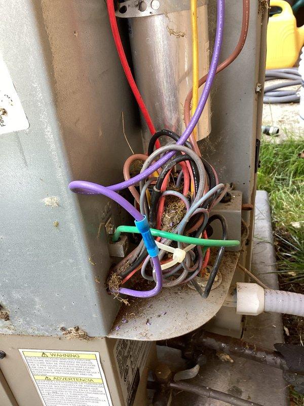 Responded to service call for air conditioning unit discharging water onto floor with suspected condensate drainage issue. Upon arrival, inspected Lennox Pulse furnace system and associated outdoor condensing unit. Examined condensate drain lines and PVC piping routing from indoor unit. Cleared blockage in condensate drain line that was causing water backup and overflow onto basement floor. Verified proper drainage flow and tested system operation to confirm issue resolved. Unit operating normally with condensate draining properly through designated drain lines.