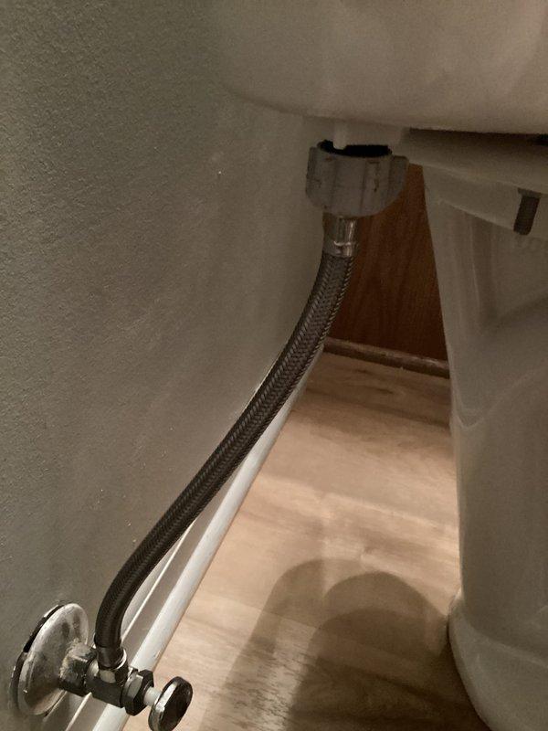 Responded to service call for toilet replacement at residential property. Successfully removed existing toilet fixture and installed new toilet unit, including connection of flexible braided stainless steel supply line to chrome angle stop shut-off valve. Verified proper water supply connection to tank inlet, ensured secure mounting to floor flange, and tested system for leaks and proper operation upon completion.
