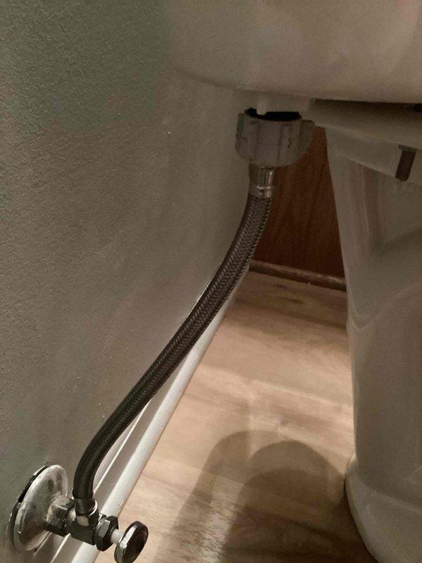 Responded to service call for toilet replacement at residential property. Successfully removed existing toilet fixture and installed new toilet unit, including connection of flexible braided stainless steel supply line to chrome angle stop shut-off valve. Verified proper water supply connection to tank inlet, ensured secure mounting to floor flange, and tested system for leaks and proper operation upon completion.