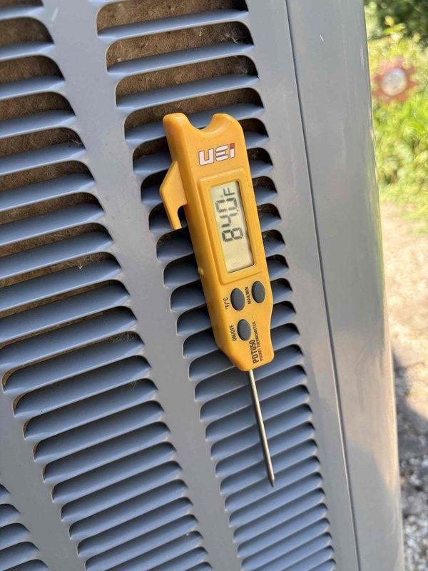 Responded to a no-cooling complaint on a residential air conditioning system installed in 2018. Upon arrival, discovered the outdoor condenser unit had severe exterior casing deterioration with extensive rust and corrosion that had compromised the structural integrity of the metal panels. Large sections of the housing showed advanced oxidation with material failure at multiple points. Measured supply air temperature at 83.3°F, confirming complete loss of cooling capacity. Documented the extensive corrosion damage to the condenser cabinet and the elevated return air temperature. The unit's deteriorated condition indicates the exterior damage has likely allowed moisture intrusion and environmental exposure that has affected internal components. System requires condenser unit replacement due to the extent of cabinet failure and inability to maintain proper cooling operation.
