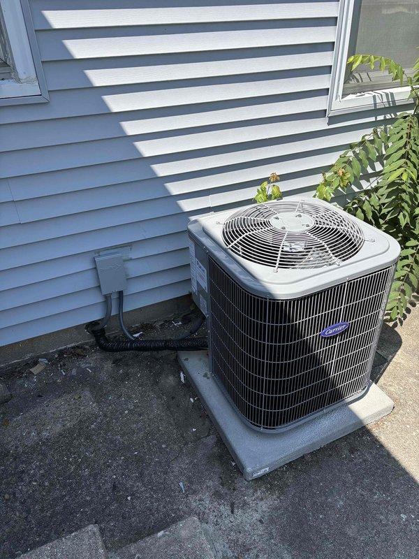 Completed full HVAC system installation including Carrier brand furnace and air conditioning condenser unit. Installed furnace in basement mechanical room with new metallic supply and return ductwork routed through ceiling joists. Positioned outdoor AC condenser unit on concrete pad adjacent to exterior wall with proper clearances, connected refrigerant lines, and installed electrical disconnect box. Established all necessary electrical connections, tested system operation, and verified proper airflow throughout ductwork. System commissioned and left in full operational condition.