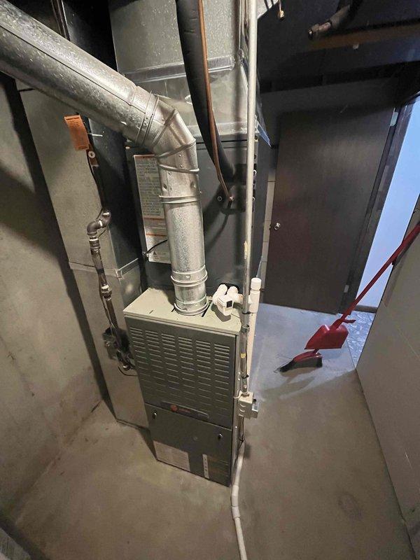 Completed full HVAC system replacement in residential basement utility area. Installed new furnace unit with properly configured ductwork connections, ensuring all metal duct joints were sealed and secured for optimal airflow. Work area was cleaned and all equipment positioned for proper clearance and serviceability.
