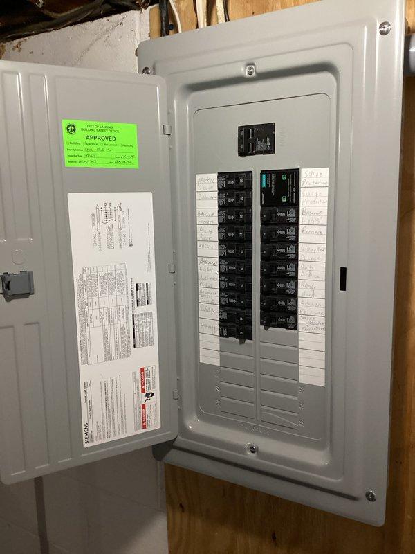 Conducted on-site evaluation for central air conditioning system installation in ranch-style home with no existing AC infrastructure. Assessed electrical service capacity and panel configuration to determine compatibility with new HVAC equipment requirements. Documented existing 200-amp electrical panel with available breaker slots and verified adequate power supply for proposed central air system installation, noting exposed basement utility area suitable for equipment placement and distribution routing.