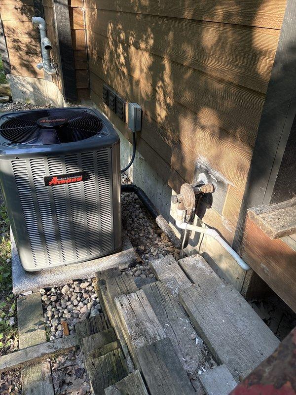 Completed inspector-required correction to relocate propane regulator piping to maintain minimum 3-foot clearance from air conditioning condenser unit per NFPA code requirements. Rerouted gas line under deck structure as requested to improve aesthetics while ensuring compliance with safety standards. Documented final installation with photographs and submitted to inspector for approval.