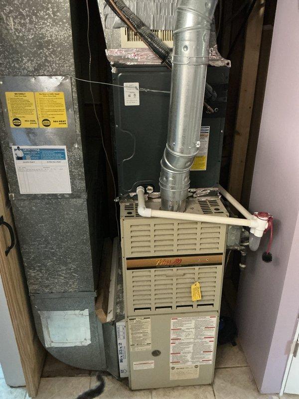 Completed annual cooling maintenance on a 9-year-old Goodman air conditioning system with Heil furnace under consumer's protection plan. Performed comprehensive inspection of outdoor condenser unit and indoor air handler, verified refrigerant lines and electrical connections, cleaned condenser coils, checked fan operation, and inspected all ductwork connections. System operating within normal parameters with no immediate repairs required; documented equipment condition with photos for service records.