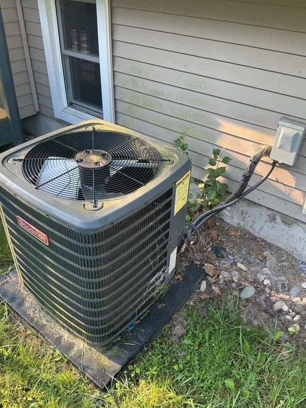 Completed annual cooling maintenance on a 9-year-old Goodman air conditioning system with Heil furnace under consumer's protection plan. Performed comprehensive inspection of outdoor condenser unit and indoor air handler, verified refrigerant lines and electrical connections, cleaned condenser coils, checked fan operation, and inspected all ductwork connections. System operating within normal parameters with no immediate repairs required; documented equipment condition with photos for service records.