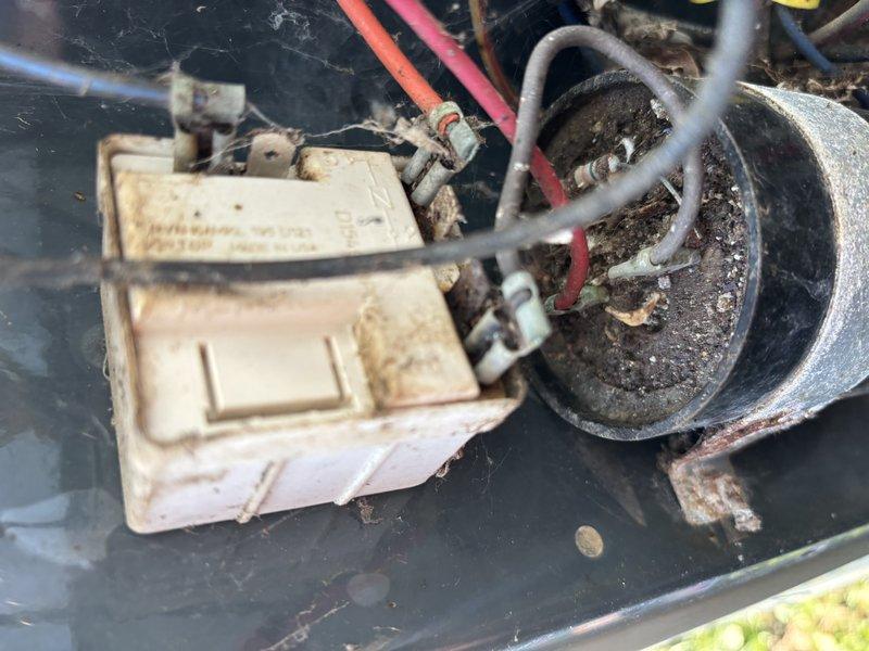 Responded to service call for air conditioning system experiencing intermittent operation and complete failure during hot weather conditions. Upon arrival, found system had been manually restarted by customer and was currently running. Performed comprehensive diagnostic inspection of indoor air handler and outdoor condensing unit. Inspected blower motor assembly, gas valve connections, electrical wiring, and capacitor for signs of failure or degradation. Found significant accumulation of dirt, dust, and debris on outdoor unit components and electrical connections, indicating lack of recent maintenance. Documented existing conditions with photographs showing interior cabinet components, wiring connections, and outdoor unit electrical assembly with visible contamination. System components showed normal operational wear with environmental exposure evident throughout. Evaluated blower motor operation, capacitor condition, and electrical connections for proper function and safety concerns.