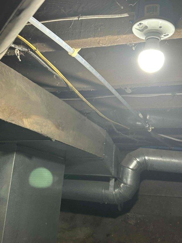 Installed dedicated bypass line to provide unsoftened water supply for outdoor use. Routed new copper piping parallel to existing water softener system, securing all runs with appropriate hangers and mounting hardware to ceiling joists in basement utility area. Customer's outdoor water source now operates independently from the water softening system while maintaining full functionality of the existing softened water distribution for indoor use.