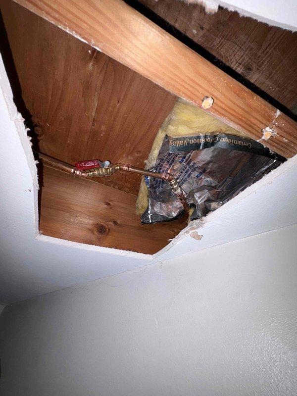 Accessed residential ceiling cavity to expose existing water supply lines. Cut opening in drywall to gain proper access to plumbing infrastructure. Replaced two existing hose bibs with new fixtures and installed two ball valves on the supply lines for improved shutoff control and system isolation. Completed work in approximately 3 hours as quoted.