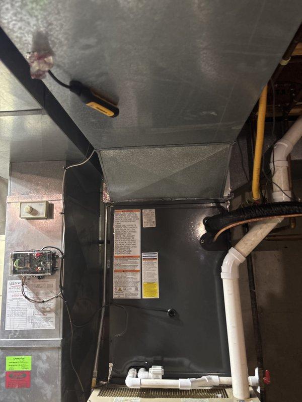 Completed full HVAC system replacement including outdoor condensing unit and indoor air handler. Installed new condenser on existing concrete pad in backyard with proper clearances from structure and fencing. Ran new refrigerant lines and electrical conduit connections between outdoor and indoor units. Mounted air handler in basement mechanical space with proper drainage piping and gas line connections. Verified all manufacturer specifications, completed electrical connections at junction box, and ensured proper labeling of all components. System tested and operational upon completion.