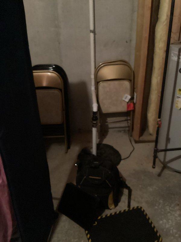 Responded to service call for 21-year-old water heater producing only lukewarm water throughout home. Upon arrival, performed diagnostic inspection of water heater system and surrounding utility area. Assessed heating elements, thermostat functionality, and overall unit condition given age of equipment. Documented existing installation and mechanical systems with photos for service records. Customer informed of findings and recommended next steps for restoring proper hot water temperature to residence.