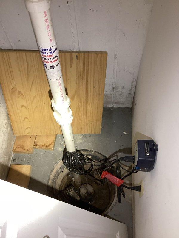 Conducted on-site evaluation for water conditioning system installation and sump pump replacement. Assessed existing plumbing infrastructure in basement utility area, including current water heater connections and available space for water softener installation. Inspected existing sump pump system, noting discharge piping configuration with white PVC vertical discharge line and current pump condition in sump basin. Documented equipment locations, plumbing connections, and electrical service availability to prepare comprehensive estimate for new water softener system and sump pump replacement.