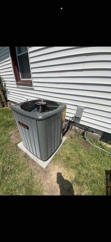 Completed full HVAC system installation including new Amana furnace and outdoor AC unit. Furnace installed in basement mechanical room on platform with proper ductwork connections to existing plenum system. Outdoor condensing unit positioned on concrete pad adjacent to structure with refrigerant lines and electrical connections completed. All equipment secured, tested, and operational per manufacturer specifications.