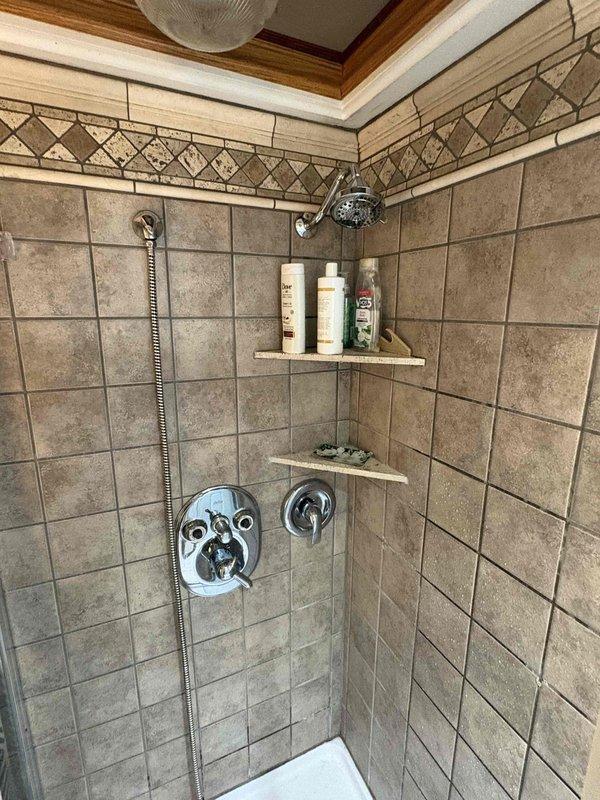 Responded to service call regarding incorrectly installed showerhead that rendered the shower unusable. Removed the previously installed incorrect unit and replaced it with the proper Delta showerhead and shower arm assembly as specified by the client. Verified proper installation, tested water flow and functionality, and confirmed client satisfaction with the completed installation.