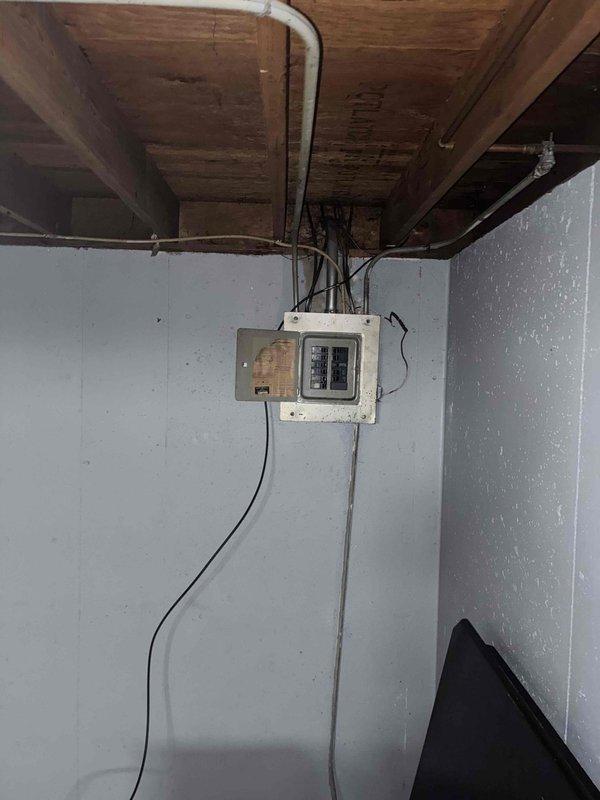 Conducted on-site evaluation for new air conditioning system installation in residential property with no existing HVAC cooling equipment. Assessed basement utility area to determine optimal placement for indoor air handler unit and reviewed existing electrical infrastructure including main breaker panel and available power supply for new AC system requirements. Documented current conditions of installation area including ceiling joist structure, wall space availability, and electrical service capacity to develop comprehensive equipment and installation estimate for complete central air conditioning system.