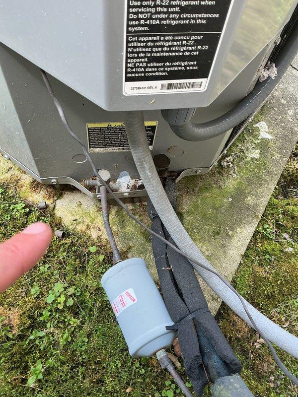 Completed annual cooling maintenance on 13-year-old International Comfort Products system utilizing R-22 refrigerant. Inspected outdoor condenser unit, refrigerant lines, and indoor evaporator coil assembly; verified all connections and components are functioning properly with normal wear consistent with system age. Documentation photos captured for service records.