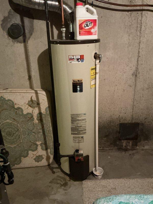 Responded to emergency call for activated carbon monoxide detector. Upon arrival, homeowner had already opened windows to ventilate the residence. Conducted thorough inspection of basement mechanical room, focusing on gas-fired water heater and associated venting systems. Tested ambient air quality with calibrated CO detection equipment throughout the home, with all readings returning to safe levels. Inspected water heater combustion chamber, burner assembly, and flue pipe for proper operation and adequate draft. Verified all gas connections for leaks using approved detection methods. Examined flexible ductwork and copper piping systems for damage or deterioration that could affect appliance performance. Found no active carbon monoxide sources or hazardous conditions present at time of inspection. Advised homeowner that initial alarm may have been triggered by temporary combustion issue that self-corrected, or detector may be reaching end of service life and require replacement. Recomm