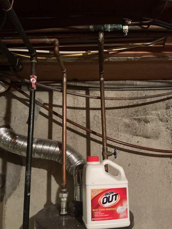 Responded to emergency call for activated carbon monoxide detector. Upon arrival, homeowner had already opened windows to ventilate the residence. Conducted thorough inspection of basement mechanical room, focusing on gas-fired water heater and associated venting systems. Tested ambient air quality with calibrated CO detection equipment throughout the home, with all readings returning to safe levels. Inspected water heater combustion chamber, burner assembly, and flue pipe for proper operation and adequate draft. Verified all gas connections for leaks using approved detection methods. Examined flexible ductwork and copper piping systems for damage or deterioration that could affect appliance performance. Found no active carbon monoxide sources or hazardous conditions present at time of inspection. Advised homeowner that initial alarm may have been triggered by temporary combustion issue that self-corrected, or detector may be reaching end of service life and require replacement. Recomm