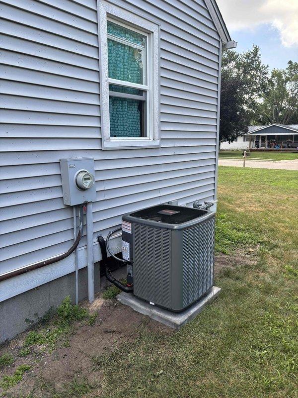 Completed full residential air conditioning system installation including outdoor condenser unit and indoor air handler components. Installed Carrier furnace system with integrated cooling coil in basement utility area, connected to new plenum and flexible ductwork distribution system. Mounted outdoor condensing unit on concrete pad with proper clearances, ran electrical conduit from meter box to equipment, and completed all refrigerant line connections between indoor and outdoor components. Verified proper airflow, tested system operation, and confirmed all electrical connections meet code requirements.