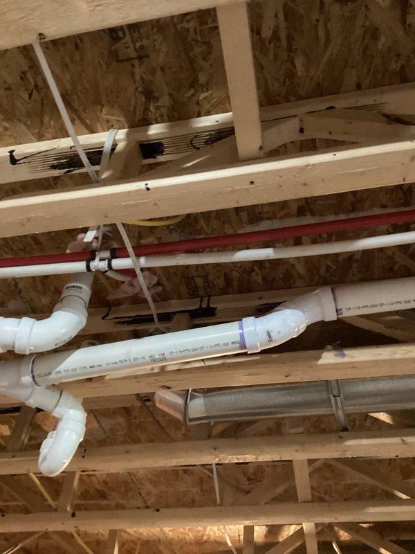 Conducted site assessment for future basement bathroom installation. Documented existing plumbing infrastructure including PVC drain lines, copper water supply lines, and available floor drain rough-ins. Evaluated ceiling joist layout, available utility routing paths, and current insulation status to provide accurate estimate for bathroom addition.