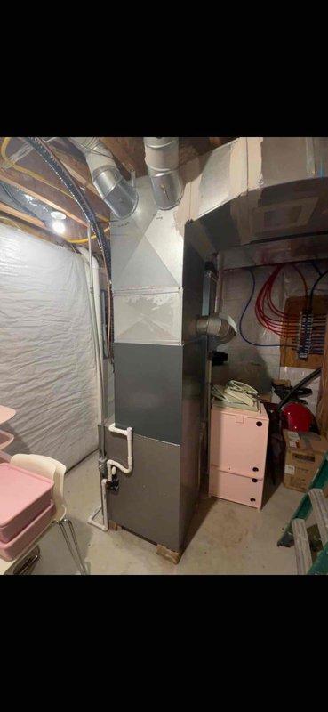 Completed full HVAC system replacement including outdoor Ameristar condensing unit installed on concrete pad with proper clearances and indoor furnace unit in basement mechanical room. Established all necessary electrical connections, PVC ductwork integration, and refrigerant line sets between indoor and outdoor components. System tested and verified operational with all safety controls functioning properly.